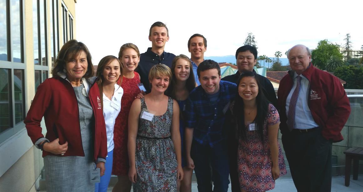 A group of people posing on a rooftop, labeled 