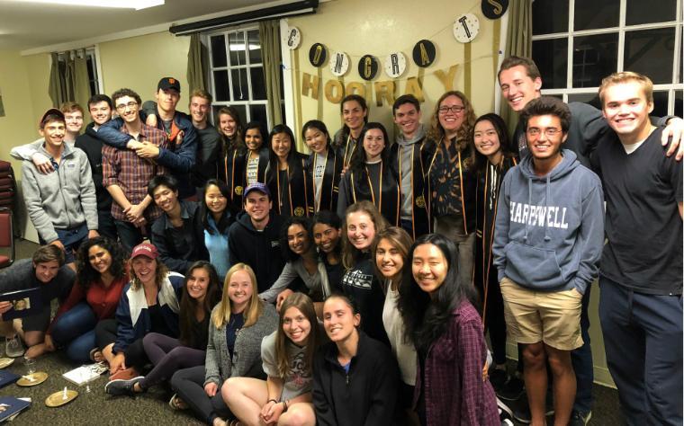 Group of people gathered indoors for the Spring Retreat 2018 alumni photo.