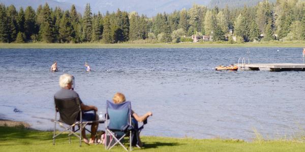 Two people looking at the lake