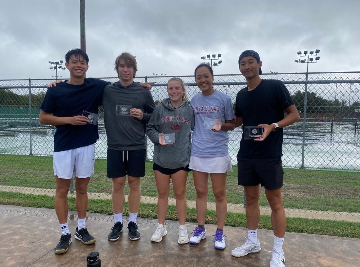 Five students each holding a small silver trophy