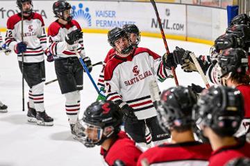 Carlin Kyhl going through the bench line after he scored a goal.