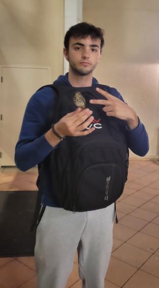 Iker Mendiburu Perez self portrait with backpack worn backwards
