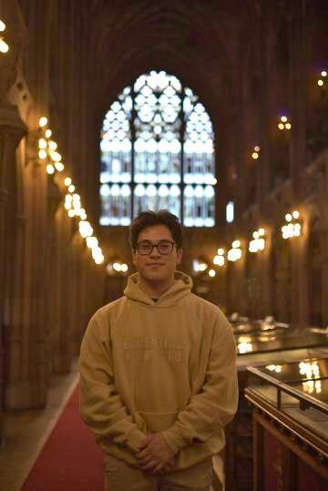 Gabe Palacio standing in a church