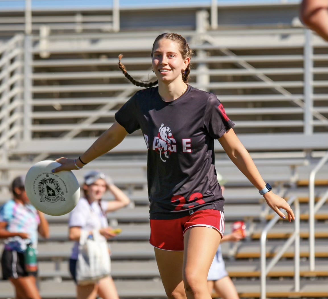 One of WLT presidents playing frisbee