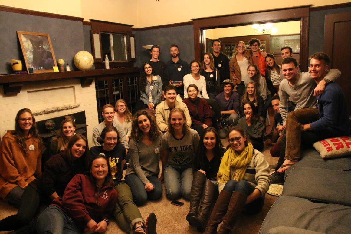 A group of SCU students enjoying a potluck dinner around sustainability