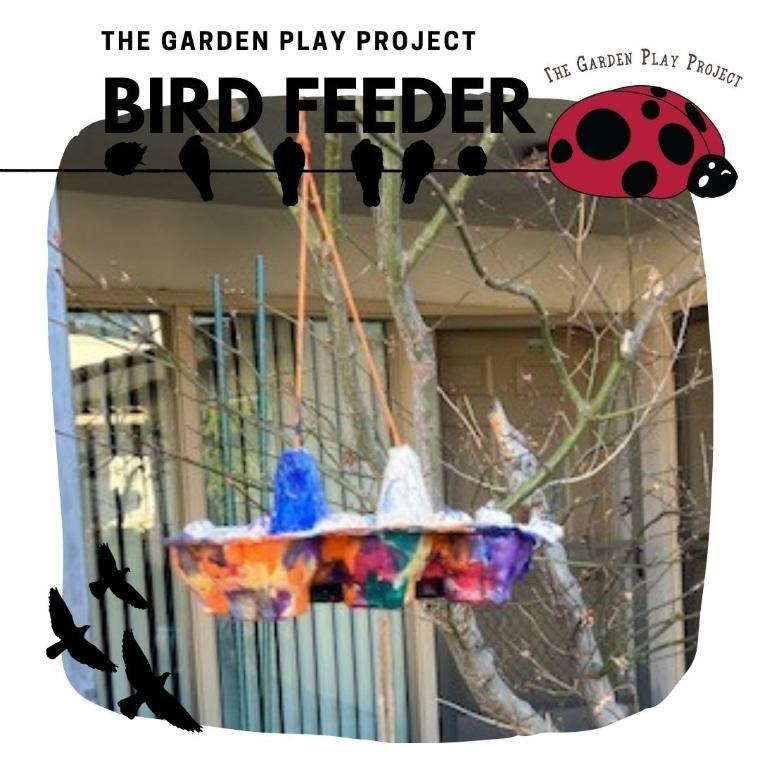 Bird feeder with colorful hanging items and text 