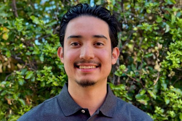 A photo of Julian smiling. 