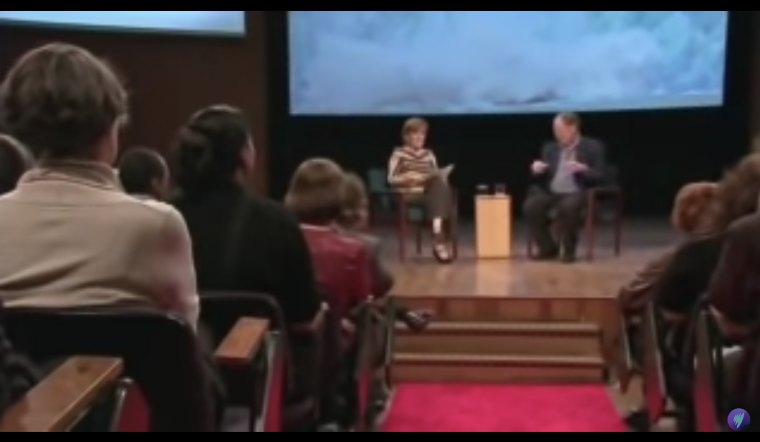 Climatologist Stephen Schneider speaks to the audience from his seat on stage next to interviewer Jenny Brockie