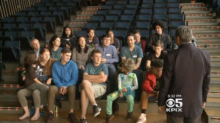 The 21 young plaintiffs in the Juliana v. United States lawsuit sit in a stadium as they are interviewed by Joe Vázquez