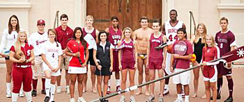 Group of people in various sports uniforms posing for a photo in front of a building. image link to story