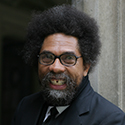 Cornel West smiling in a dark suit and tie.