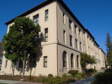 Exterior of a beige academic building named 