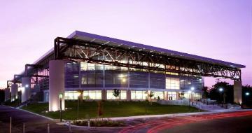 The exterior of the Leavey Center at twilight.