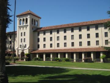 Nobili Hall building with a tall tower and arched windows.