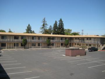 A building with a parking lot labeled 'St. Clare'.