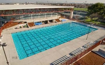 Outdoor pool at the Sullivan Aquatic Center with diving boards and spectator seating.