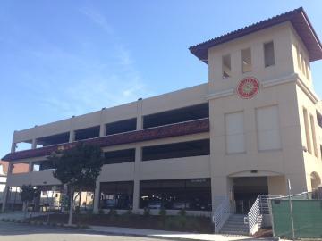 Parking structure with multiple levels and tower labeled 'North Campus Parking Structure'.