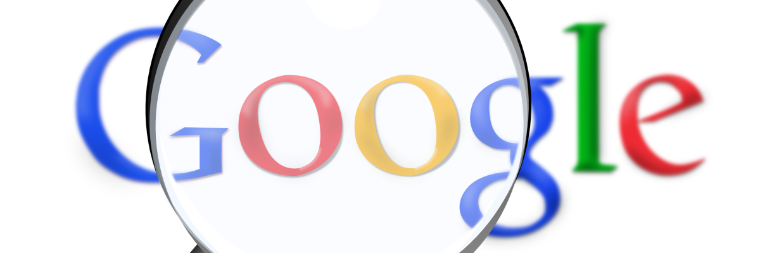 Alt text: Magnifying glass enlarging 'Google' logo letters.