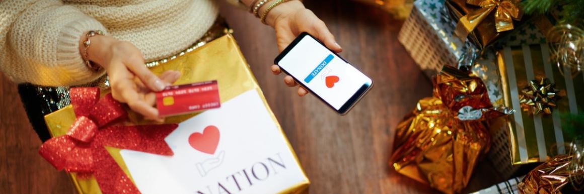 Photo of woman donating to charity on her smartphone.