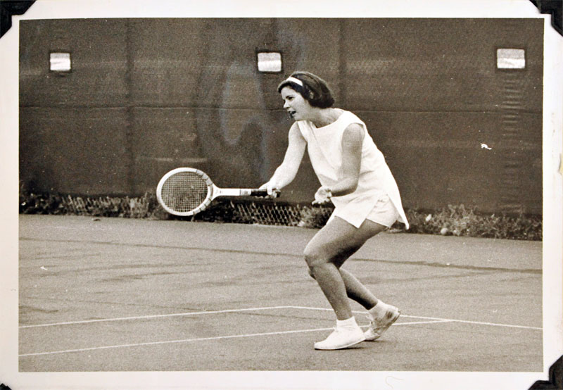 Sepia photo of a tennis player in action, 1965.
