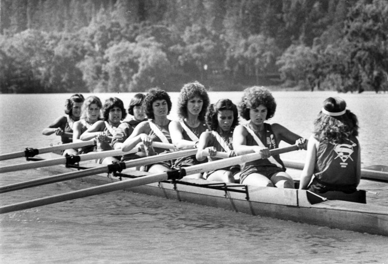 A 1970s rowing crew in action on the water.