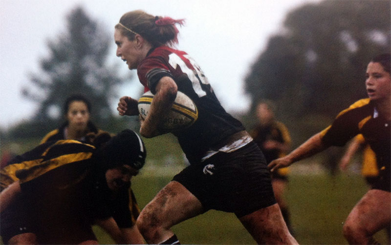 Players running during a 2005 rugby match, with the ball carrier in the lead.