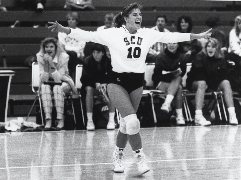 A volleyball player in action on the court.