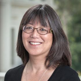 Woman smiling outdoors with glasses, titled 'MarthaMatsuoka_OXY'.