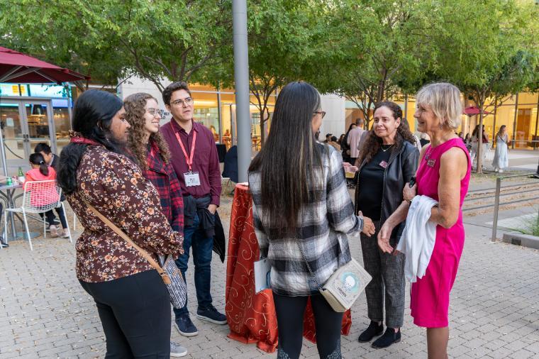 Alumni/ae meet up with Dean Elaine Scott and Professor Silvia Figueira at the 2023 Grand Bash. Photo courtesy of Santa Clara University.