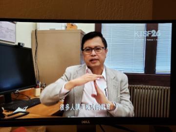 Dr. Ling on KTSF Channel 26 TV News, sitting in an office.