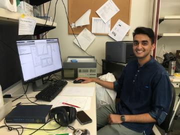 Amritpal Singh sitting in front of a computer in a lab