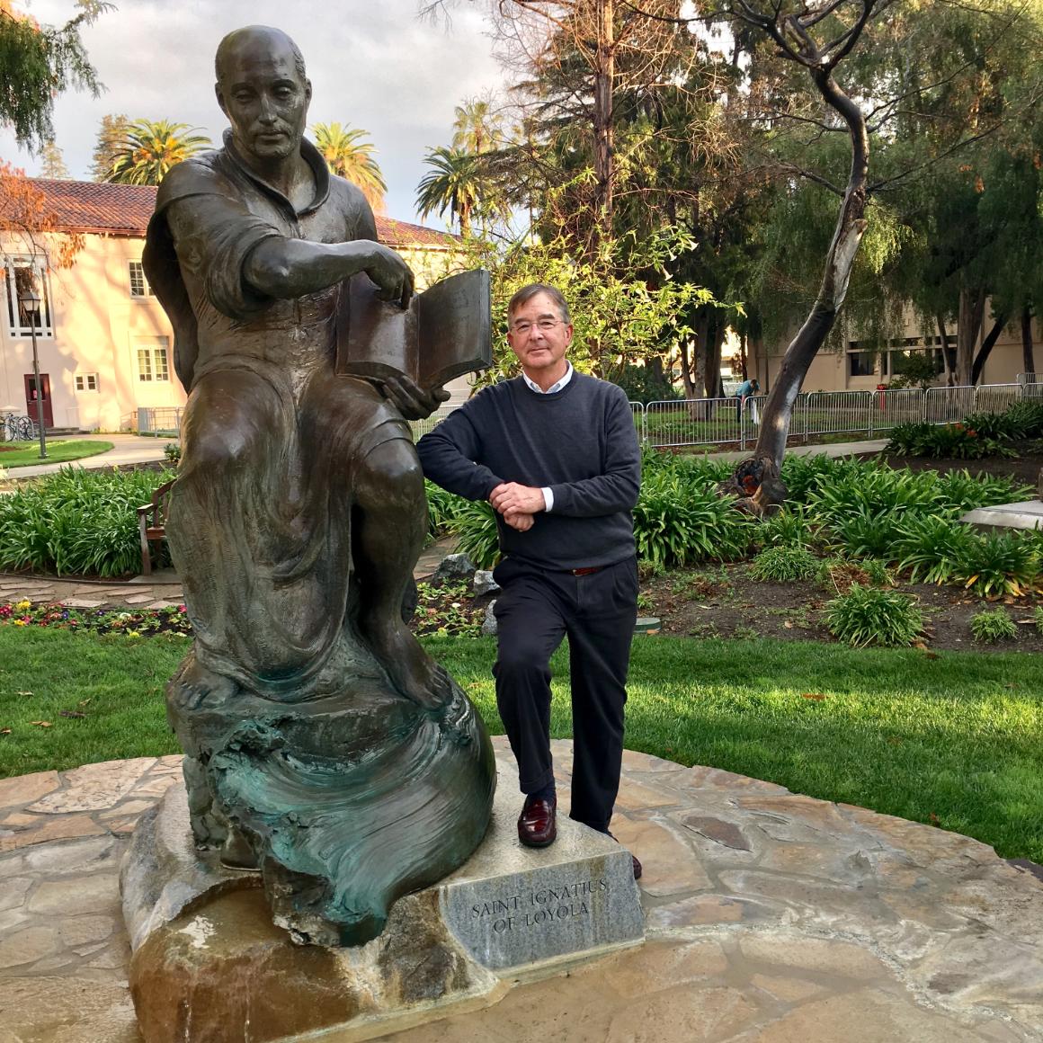 Lanny Vincent with SCUs statue of St. Ignatius