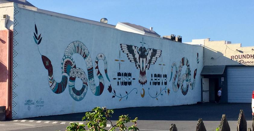 Wall artwork depicting the phrase rise above from the Washington neighborhood in San Jose