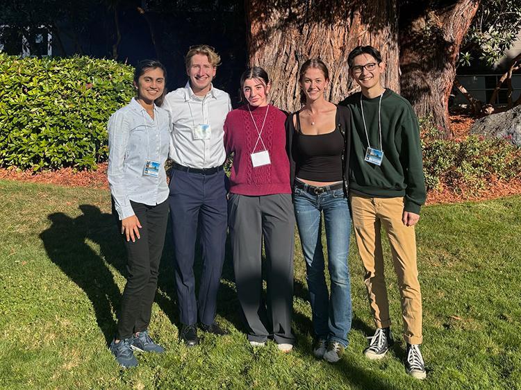 5 SCU Physics students outside by a tree