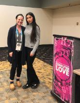 Amy Lueck and a female SCU student at a conference after their presentation