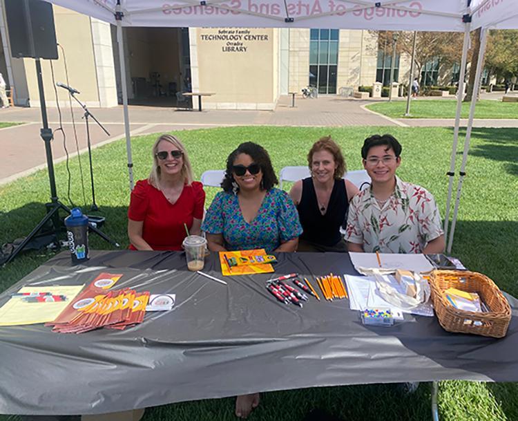 2 faculty directors and a student assistant tabling at the SCU Center for Art & Humanities pop up Arts event