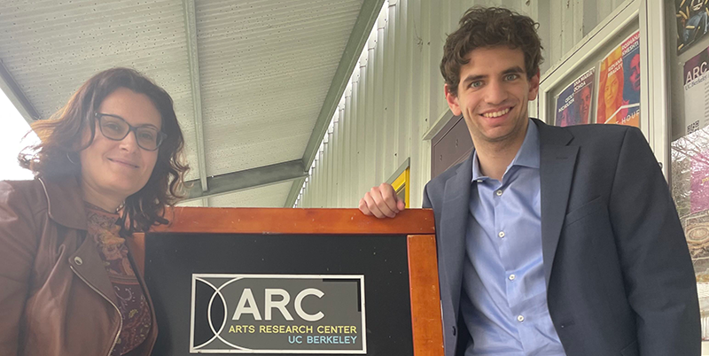 Evelyn Ferraro and Agustin Pace standing next to Arts Research Center sign 