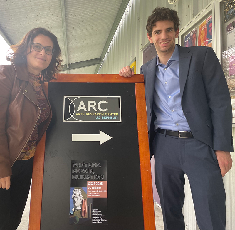 Evelyn Ferraro and Agustin Pace standing next to Arts Research Center sign
