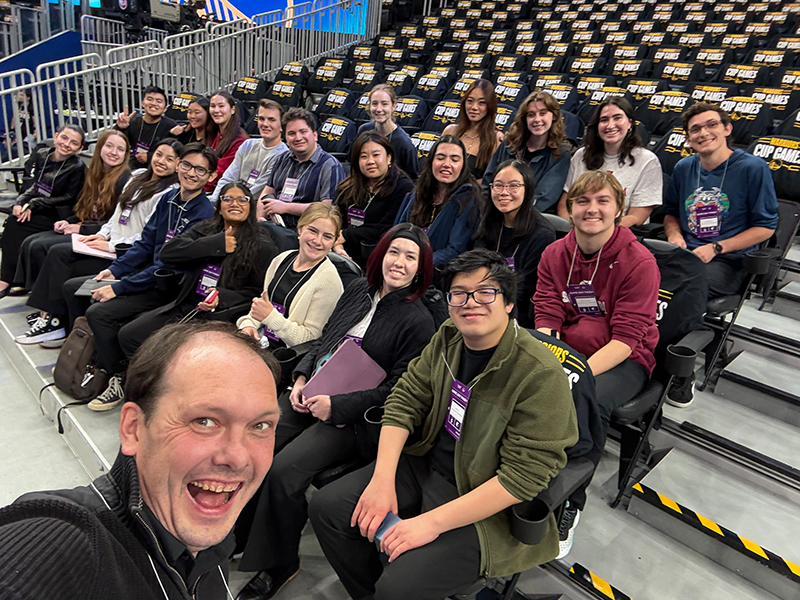 Scot Hanna-Weir and the SCU Chorus at in stands at the Golden State Warriors arena