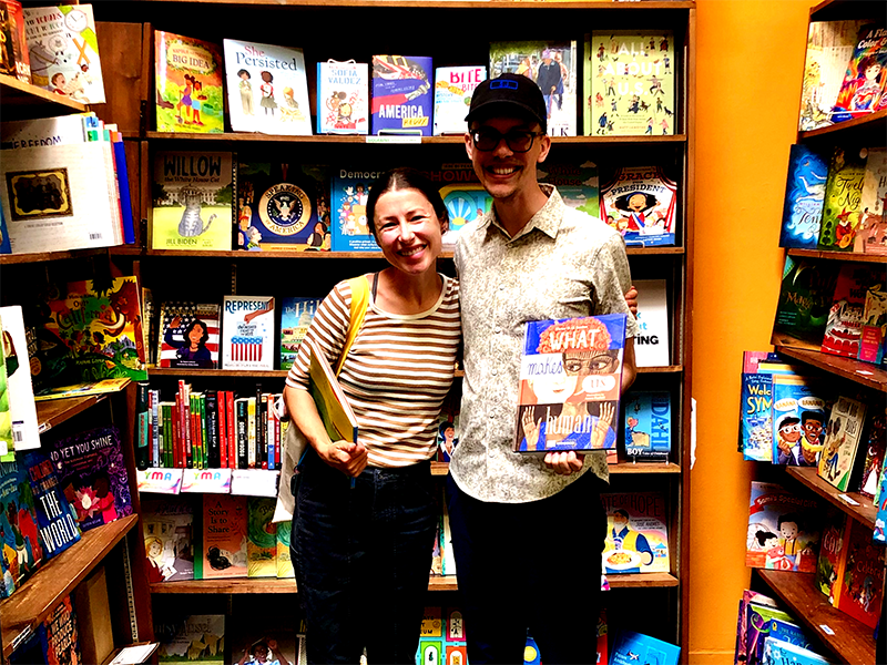 Brita A. Bookser and Timothy J. Williamson investigate picture books in 2024 at Hicklebee's Bookstore in San José.
