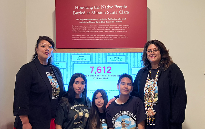 Ohlone descendents, including co-author Isabella Gomez, in front of the Native Cemetery Memorial