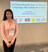 Yujie Ge standing next to her presentation title slide.