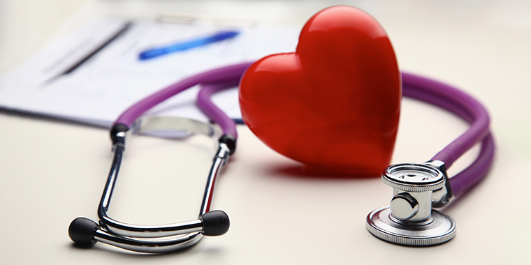 Stylized stethoscope with a purple tube and a red heart 