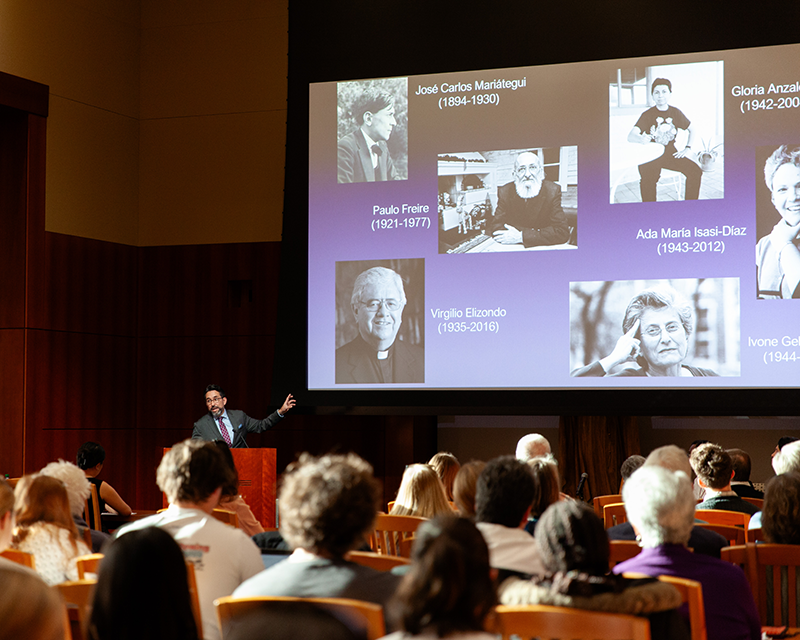 Chris Tirres speaking at the podium.