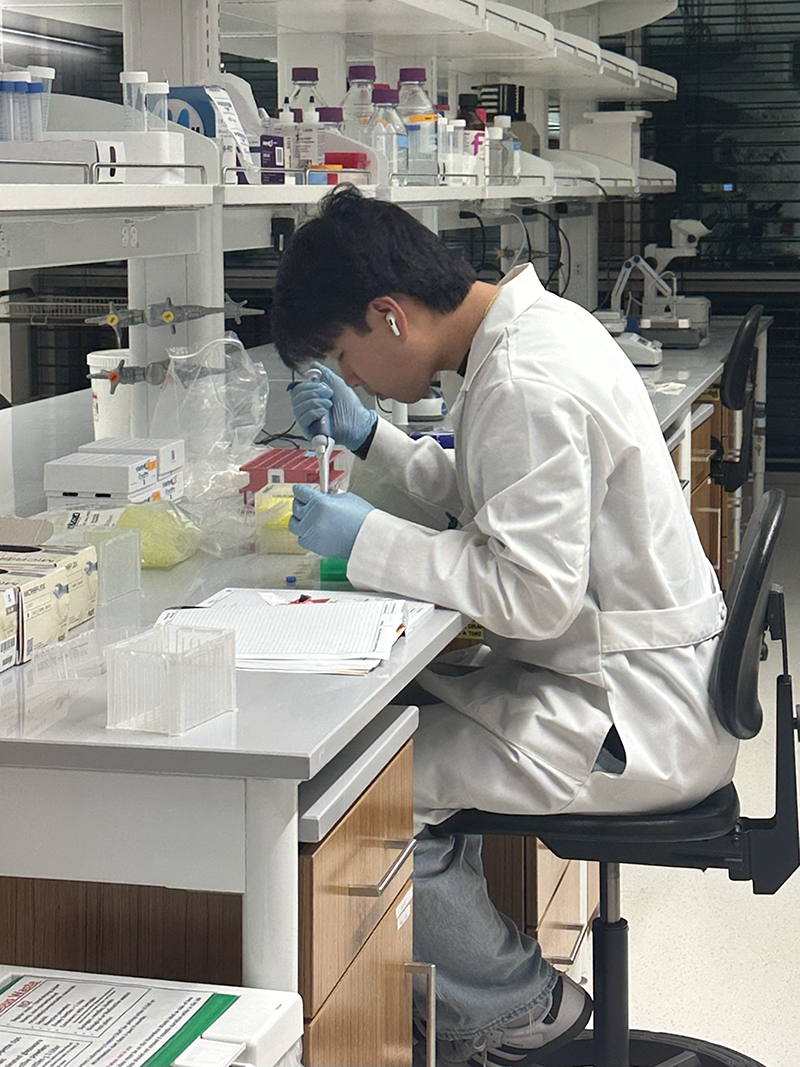 Colin Smith conducting research in a lab