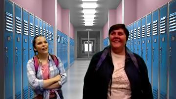 Two female students standing in a school locker hallway.