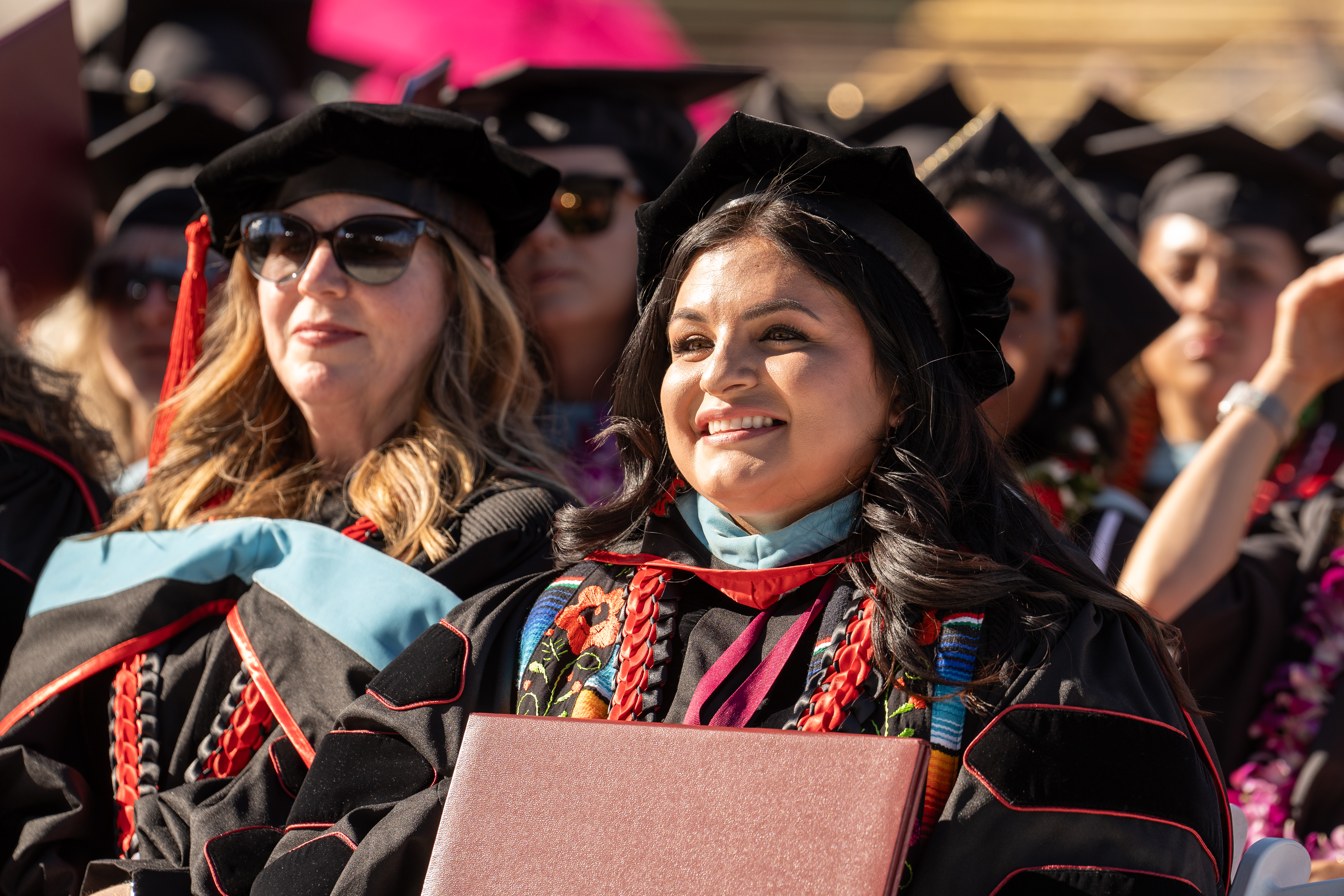 Student with a smiling face at graduation ceremony 