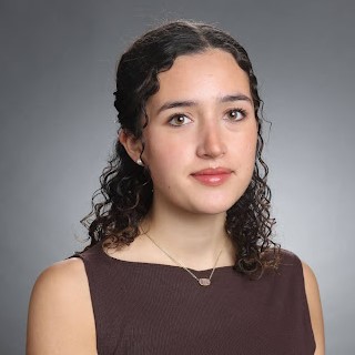 A woman in brown top
