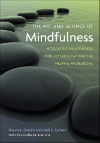 Cover of 'The Art and Science of Mindfulness' by Shapiro and Carlson with smooth stones.