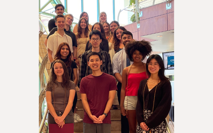 2024 Markkula Center Grads smiling on staircase in Vari Hall